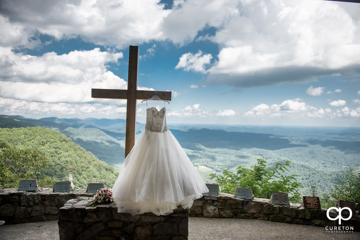 Bride's dress hanging on the cross at Pretty Place.