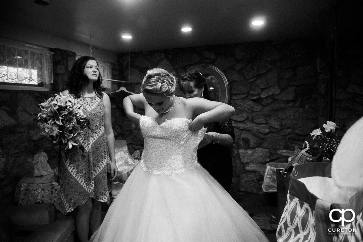 Bride getting dressed.
