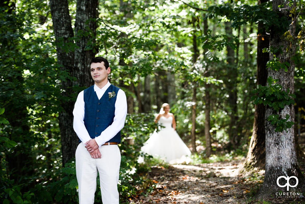 Groom awaiting his bride during the first look at Pretty Place before the wedding ceremony.