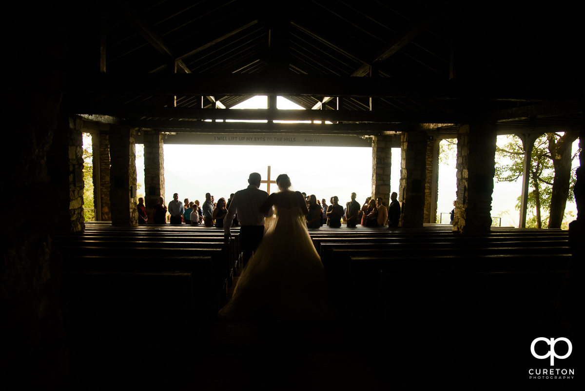 Bride walking down the aisle at Pretty Place before the wedding.