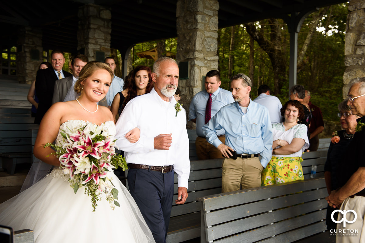 Bride and her father walking down the aisle.