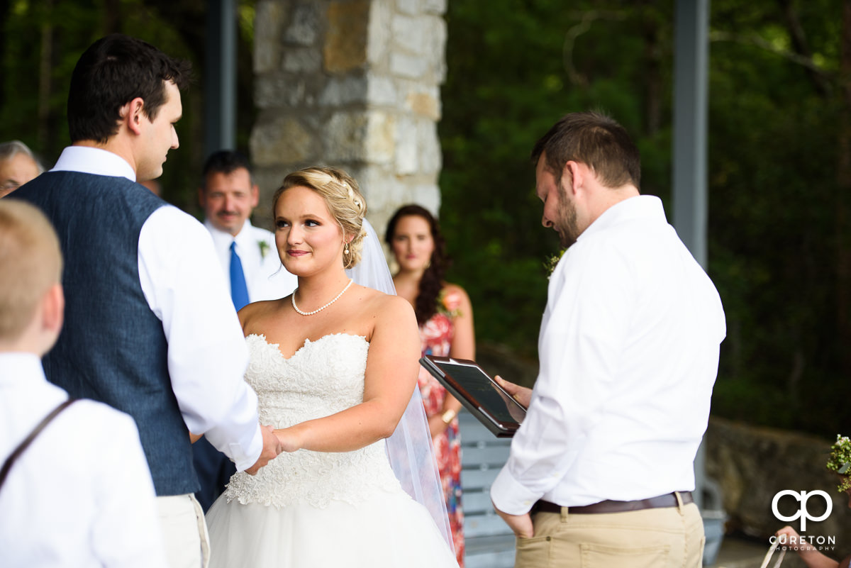 Bride looking at the groom during the ceremony.