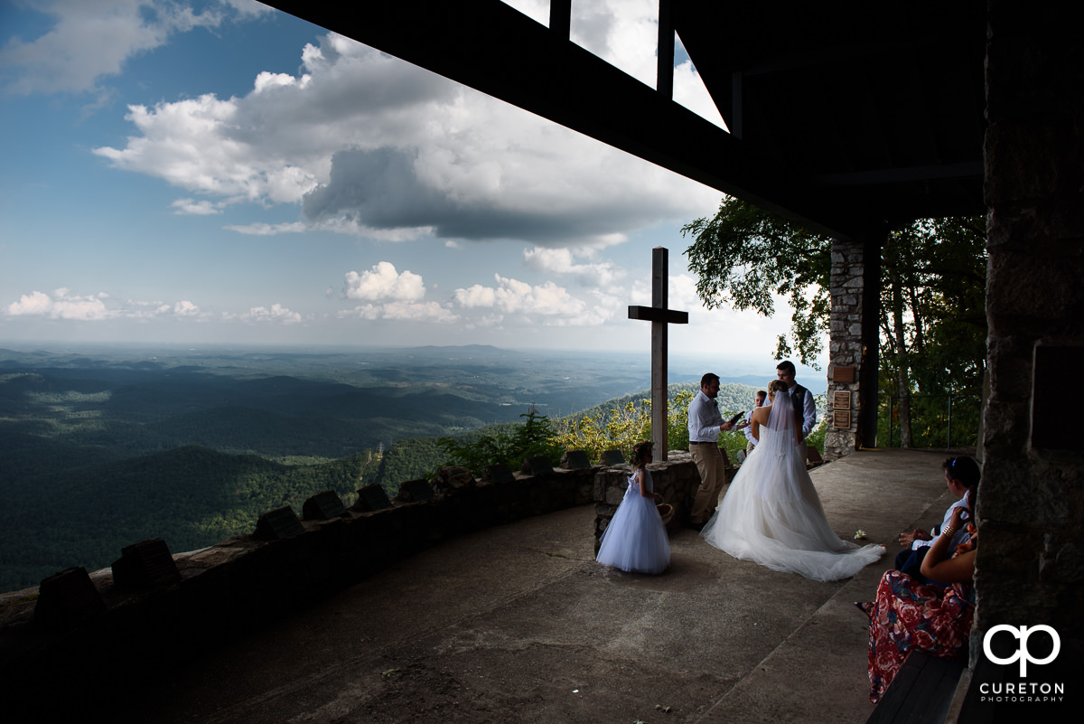 Bride and groom during the wedding ceremony at Symmes Chapel.
