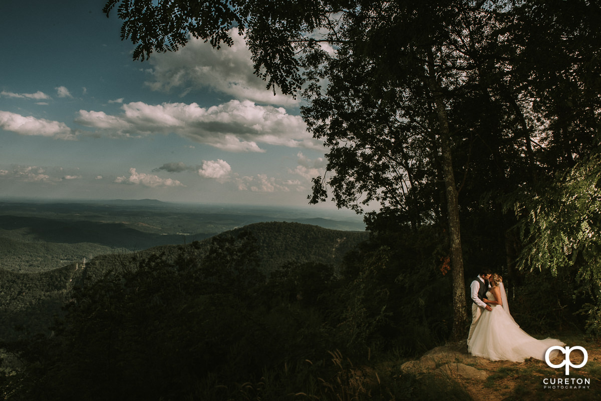 Bride and groom on an epic South Carolina mountaintop after their wedding at Pretty Place, aka Symmes Chapel.