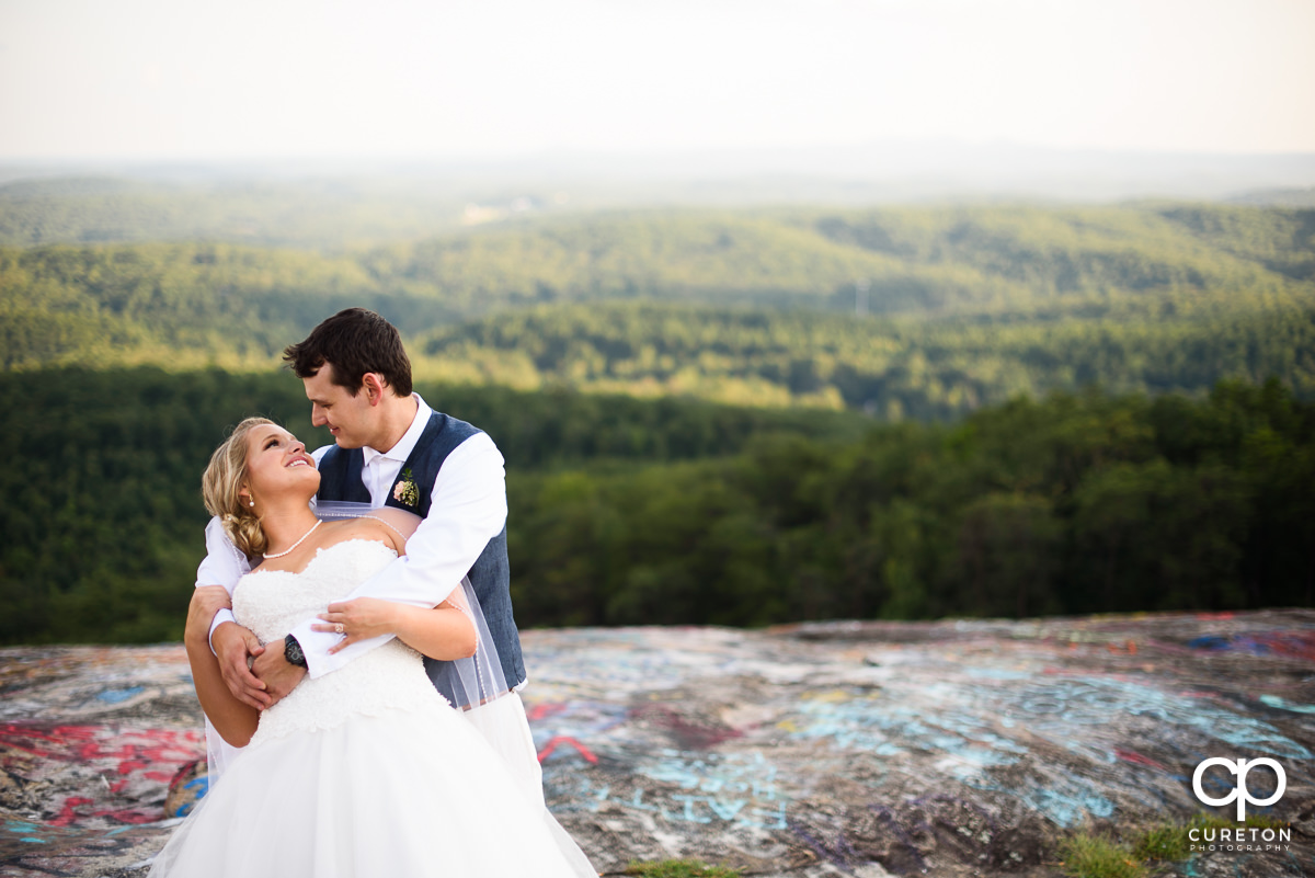 Bride and groom dancing on Bald Rock.