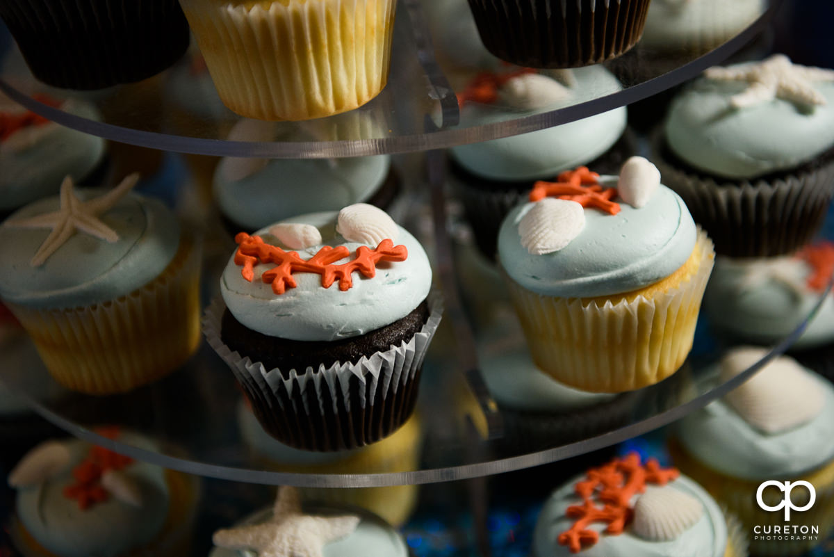 Beach themed wedding cupcake.