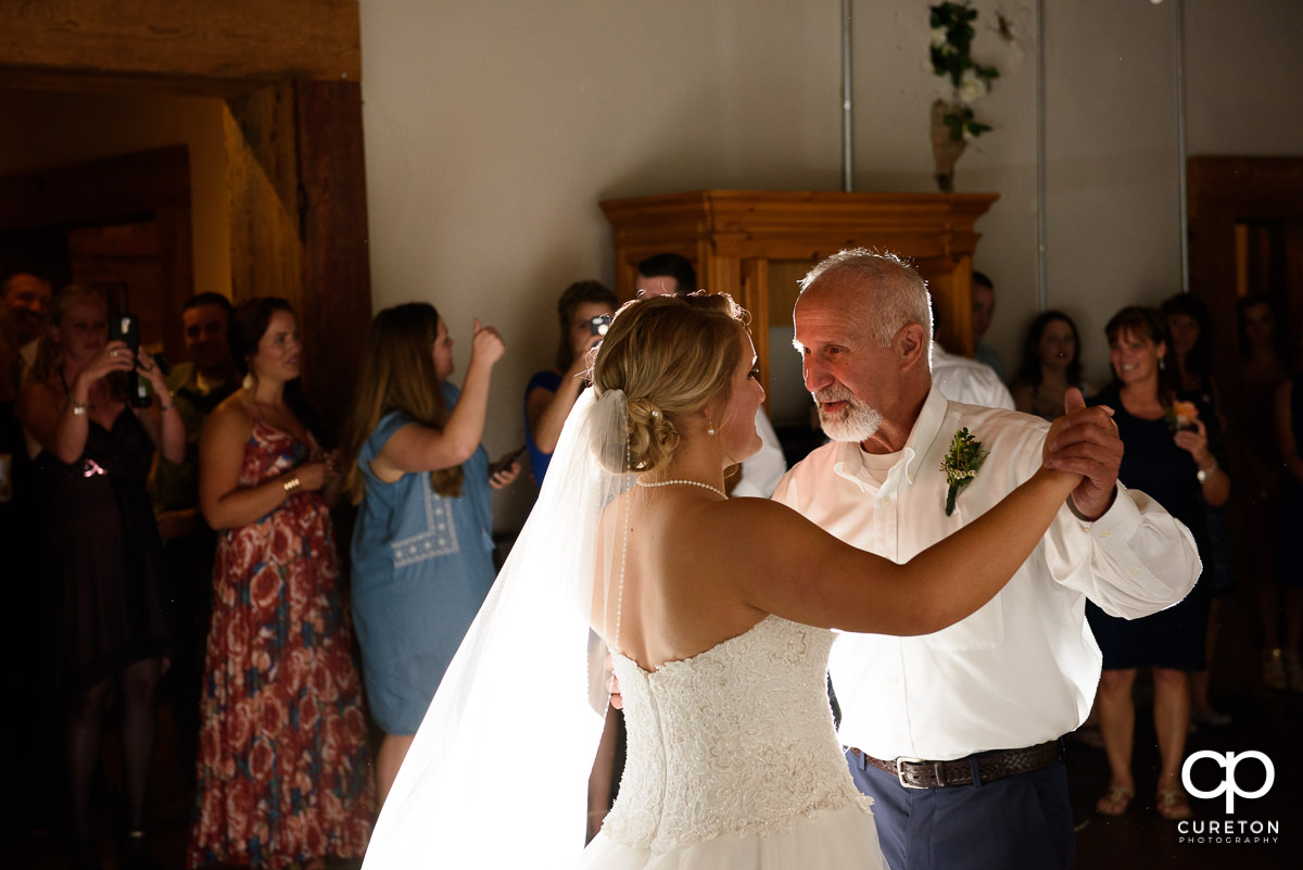Bride and father dance at Artisan Traders.