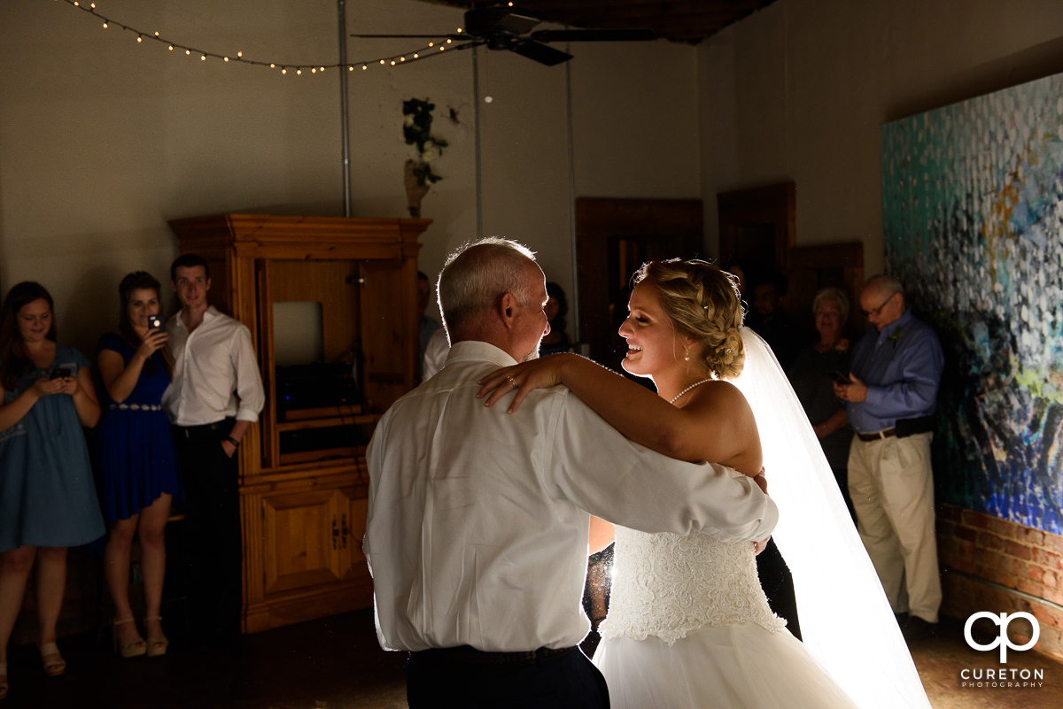 Bride and father dance at Artisan Traders.