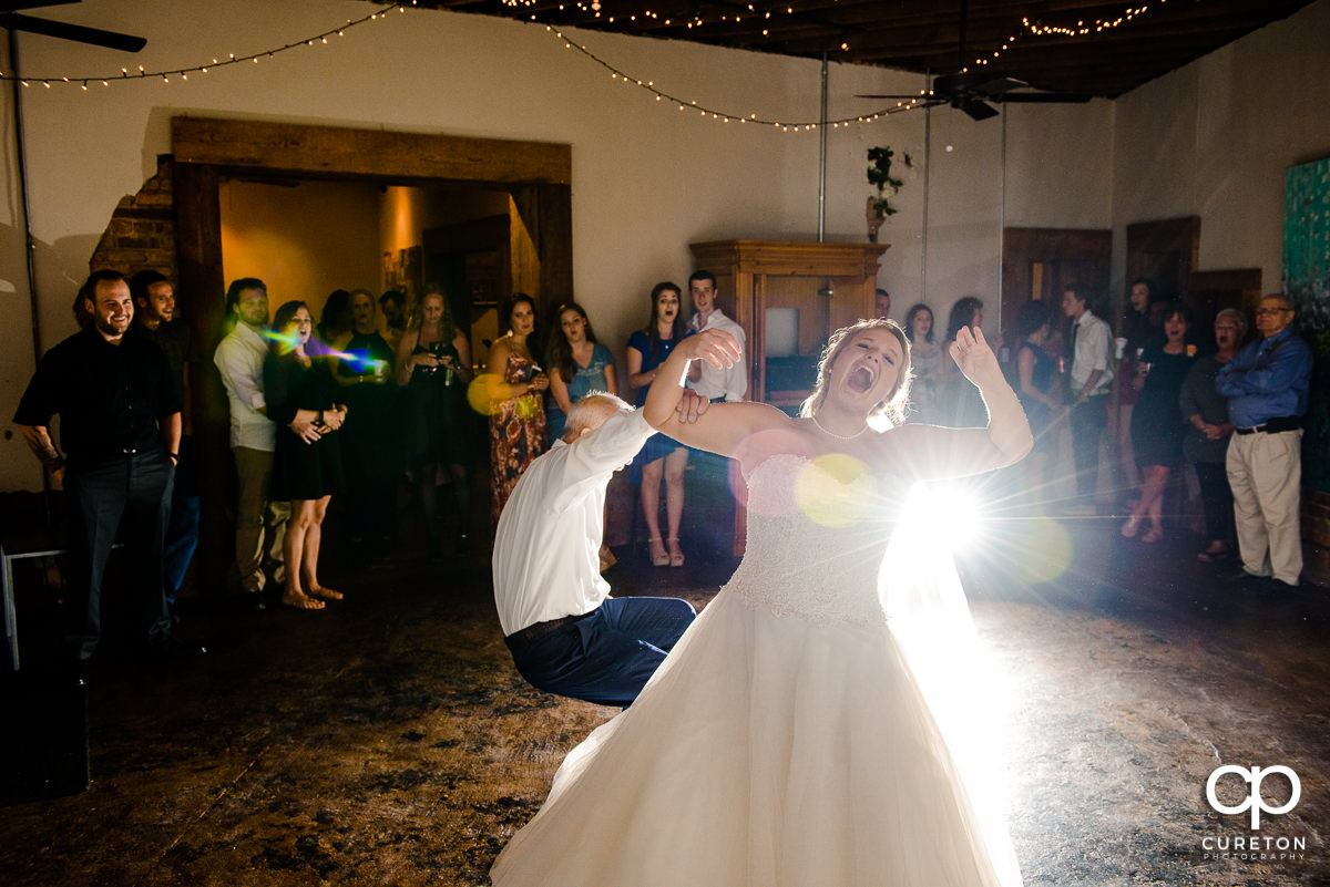 Bride's father tripping and falling during the bride and father dance.