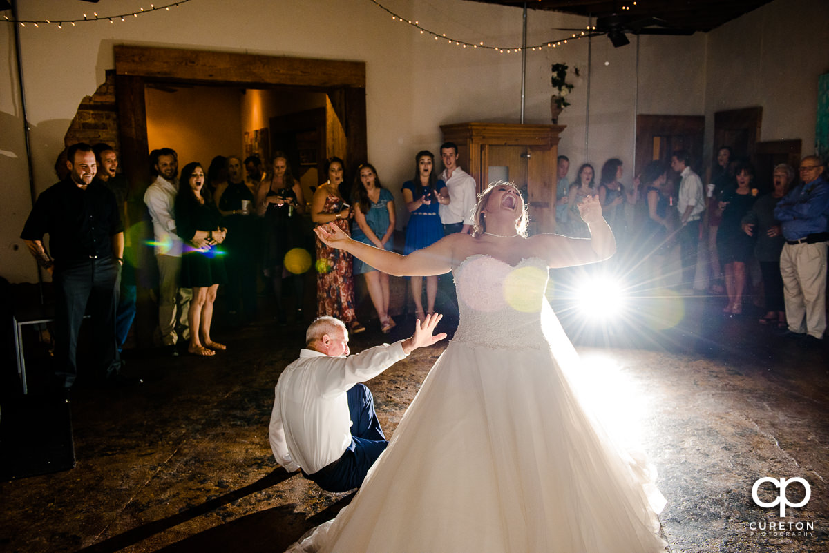 Bride's father tripping and falling during the bride and father dance.