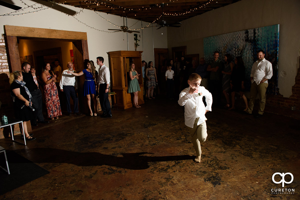 Ring bearer dancing.