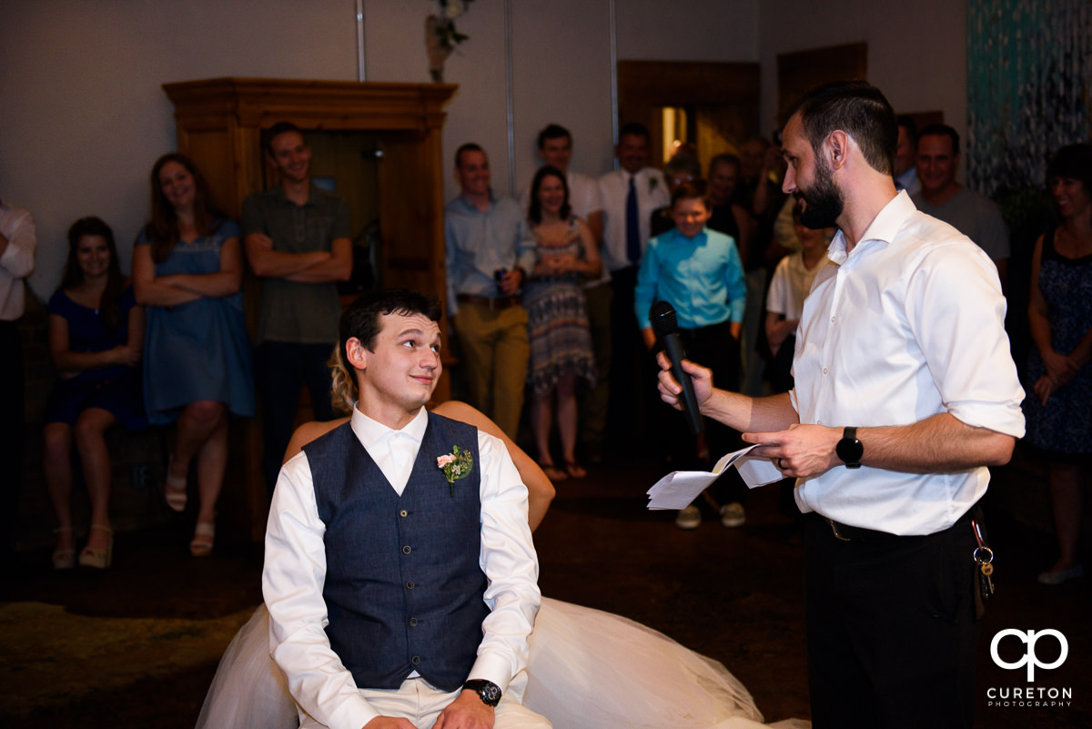 Bride and groom playing the shoe game.