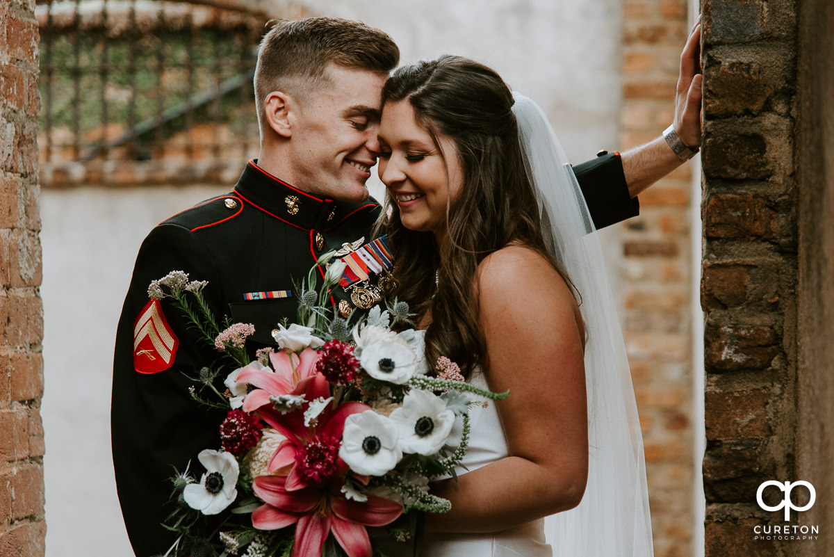 Bride and groom sharing a laugh after their wedding.