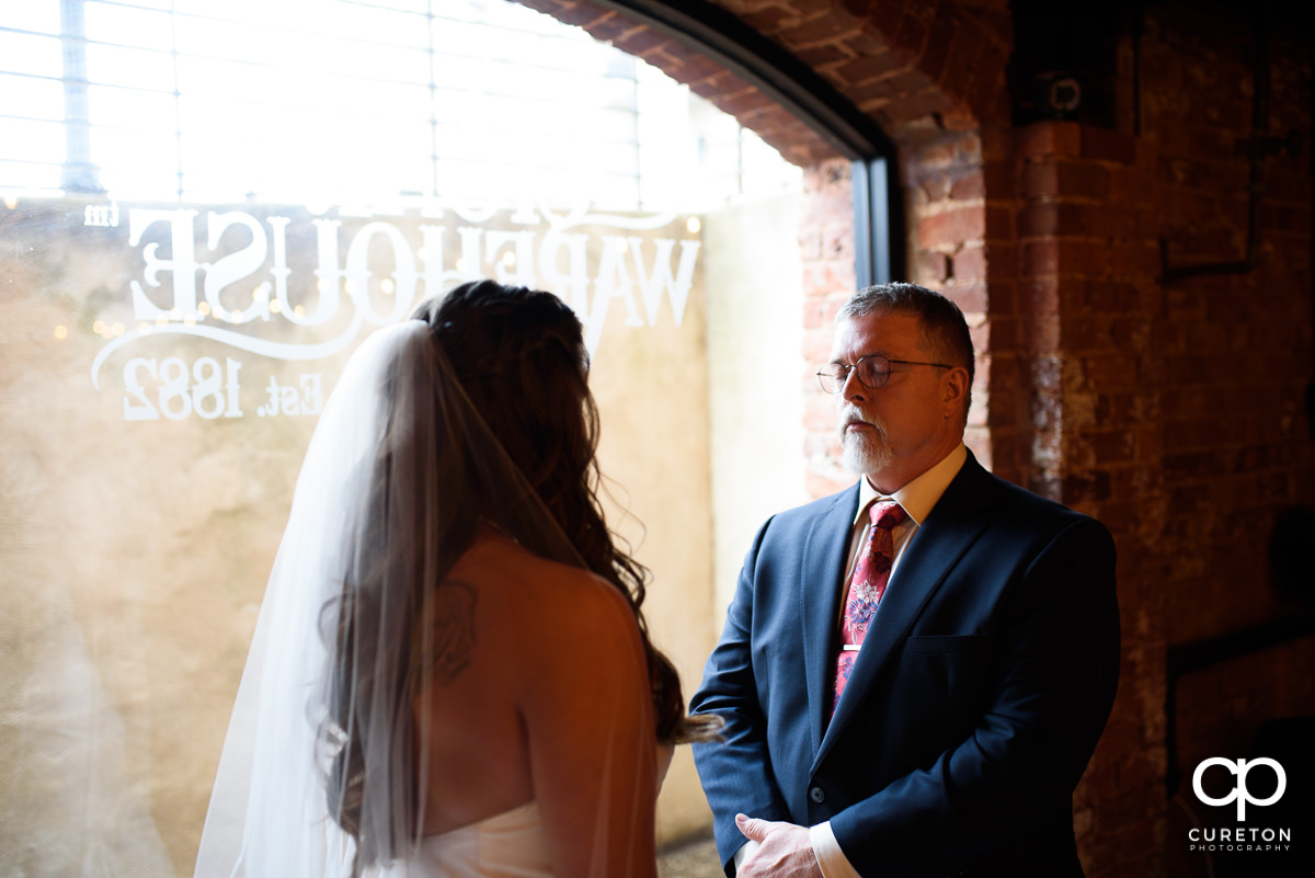 Bride having a first look with her dad before the ceremony.