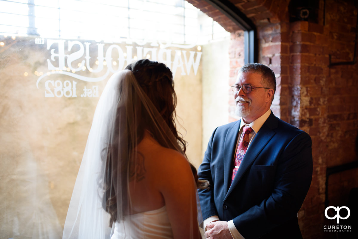 Bride having a first look with her dad before the ceremony.