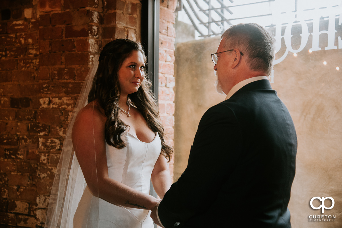 Bride having a first look with her dad before the ceremony.