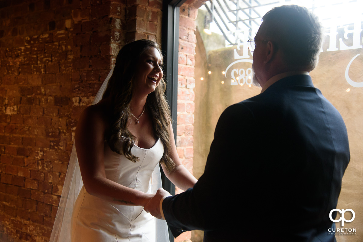 Bride having a first look with her dad before the ceremony.