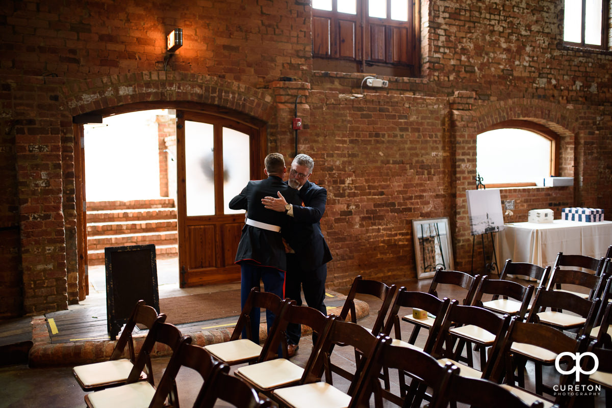 Groom and the bride's father talking.