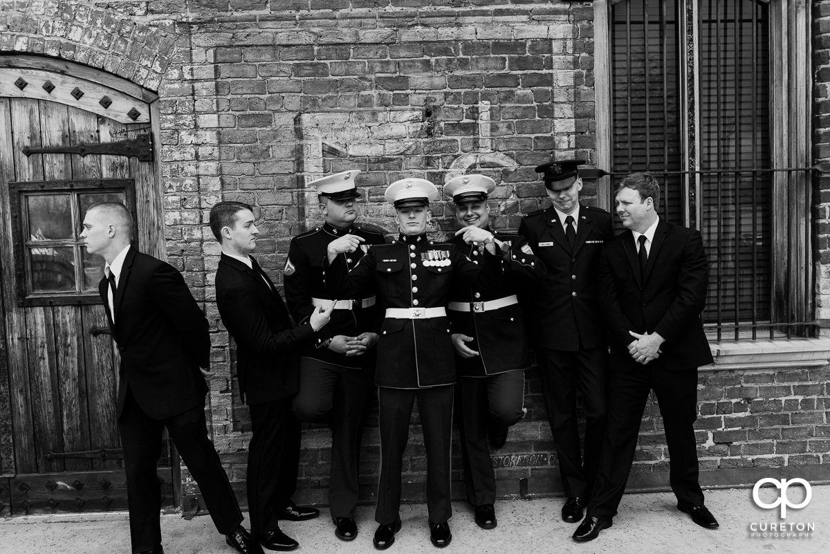 Groom and groomsmen on the deck at The Old Cigar Warehouse in Greenville.