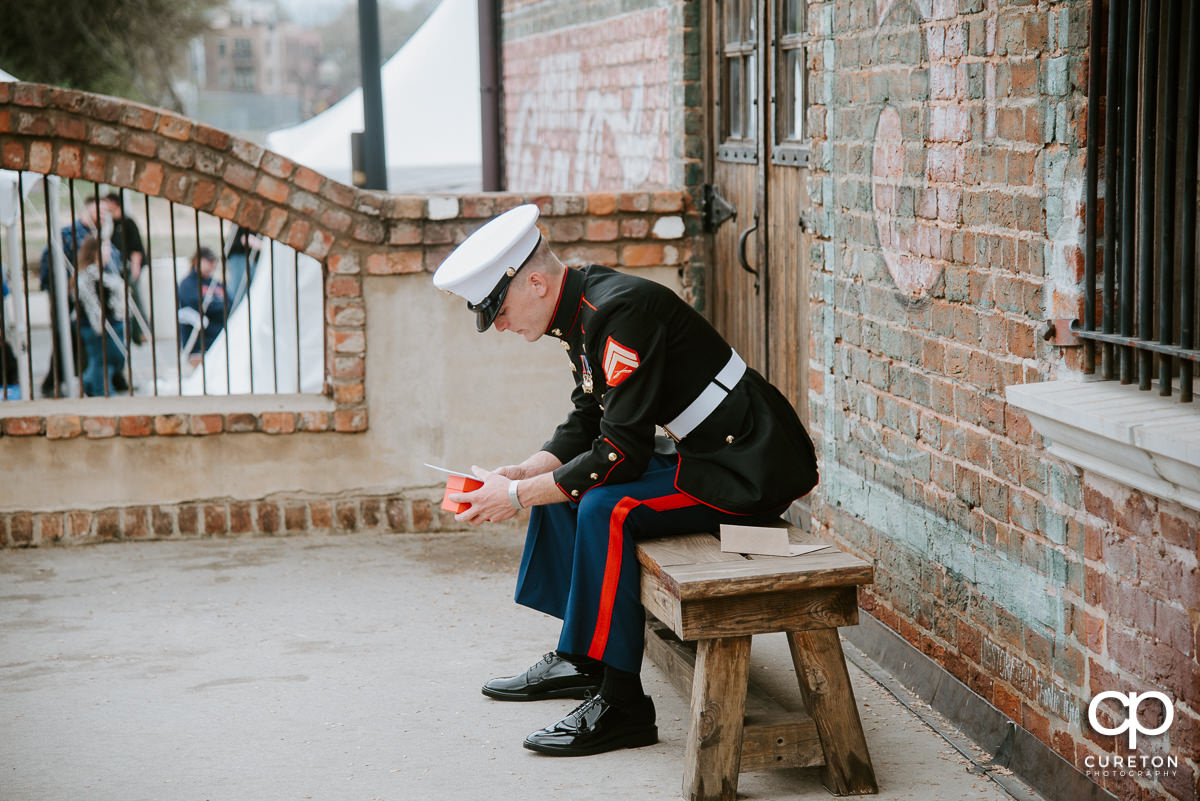 Groom reading a letter from his bride.