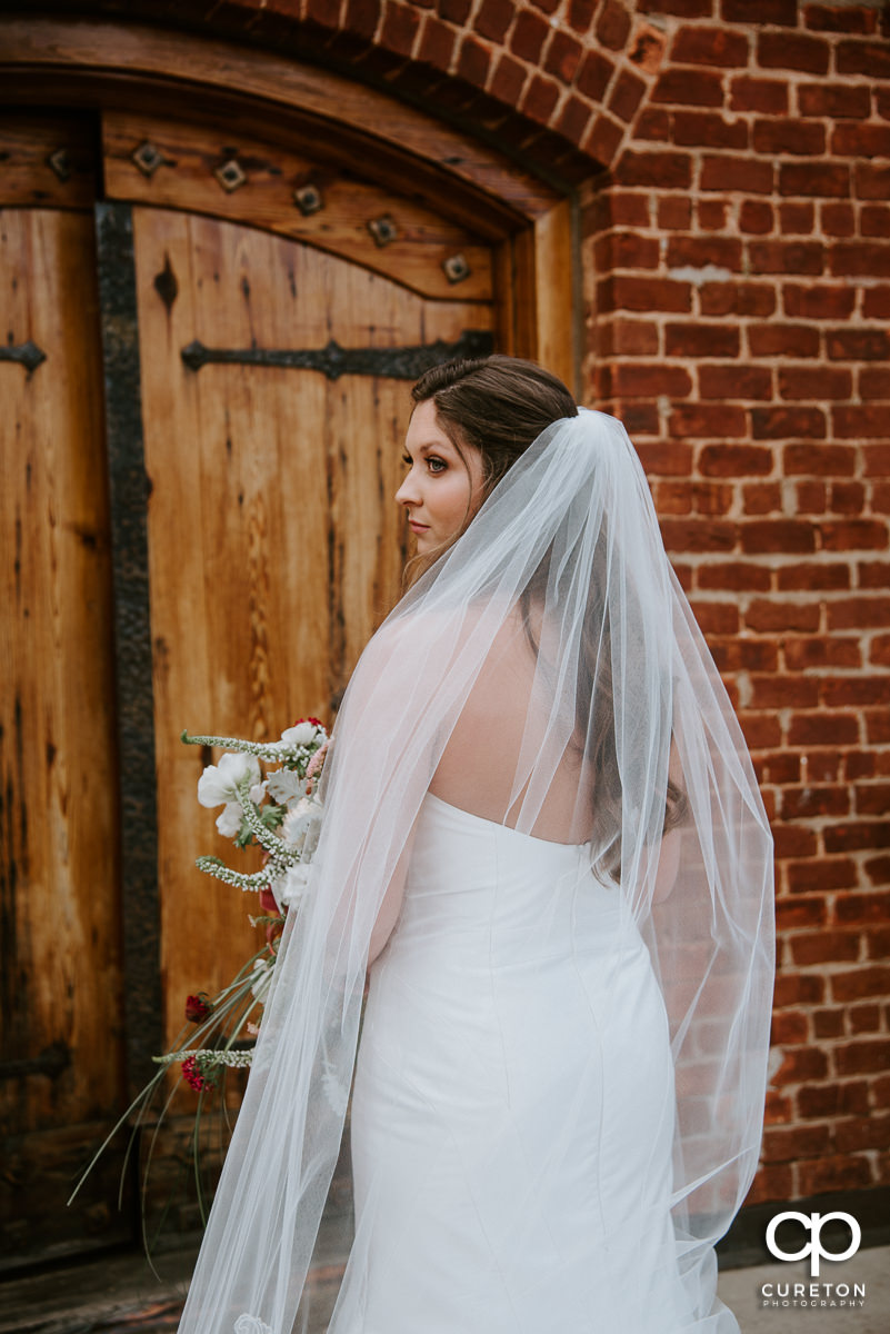 Bride getting ready to walk down the aisle at The Old Cigar Warehouse wedding ceremony.