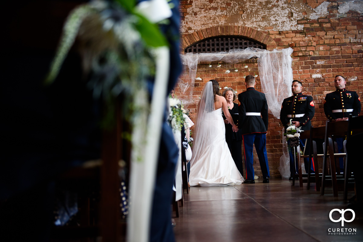 Bride and groom getting married at the Old Cigar Warehouse.