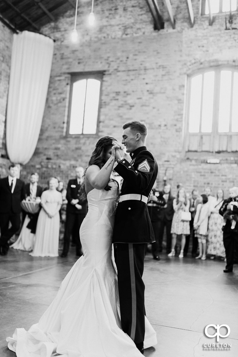 Bride and groom sharing a first dance.