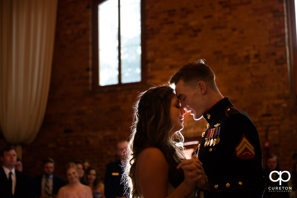 Bride and groom sharing a first dance at the wedding reception.