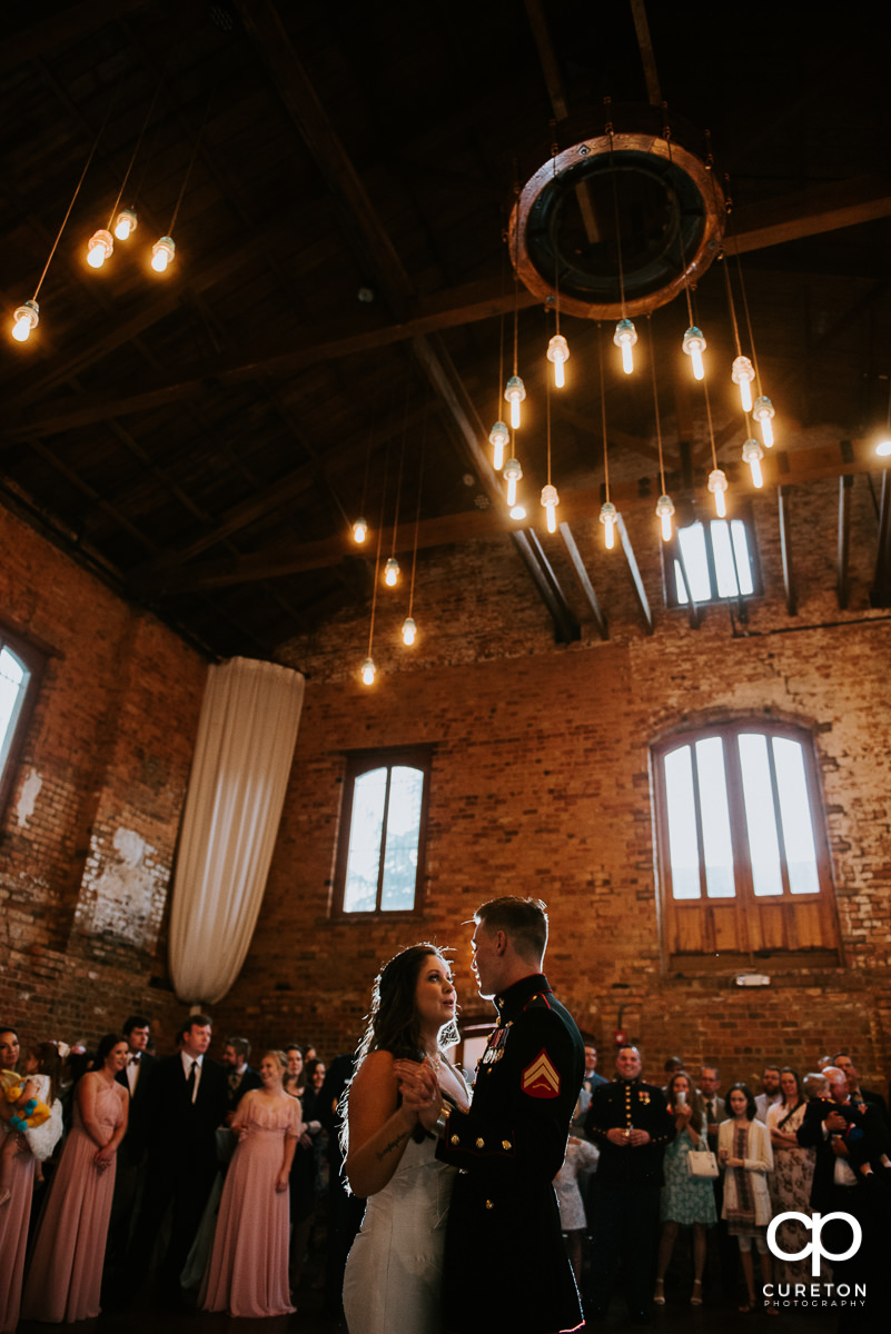 Bride and groom sharing a first dance at the wedding reception at The Old Cigar Warehouse.