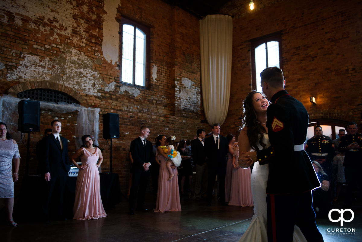 Bride and groom sharing a first dance at the wedding reception.