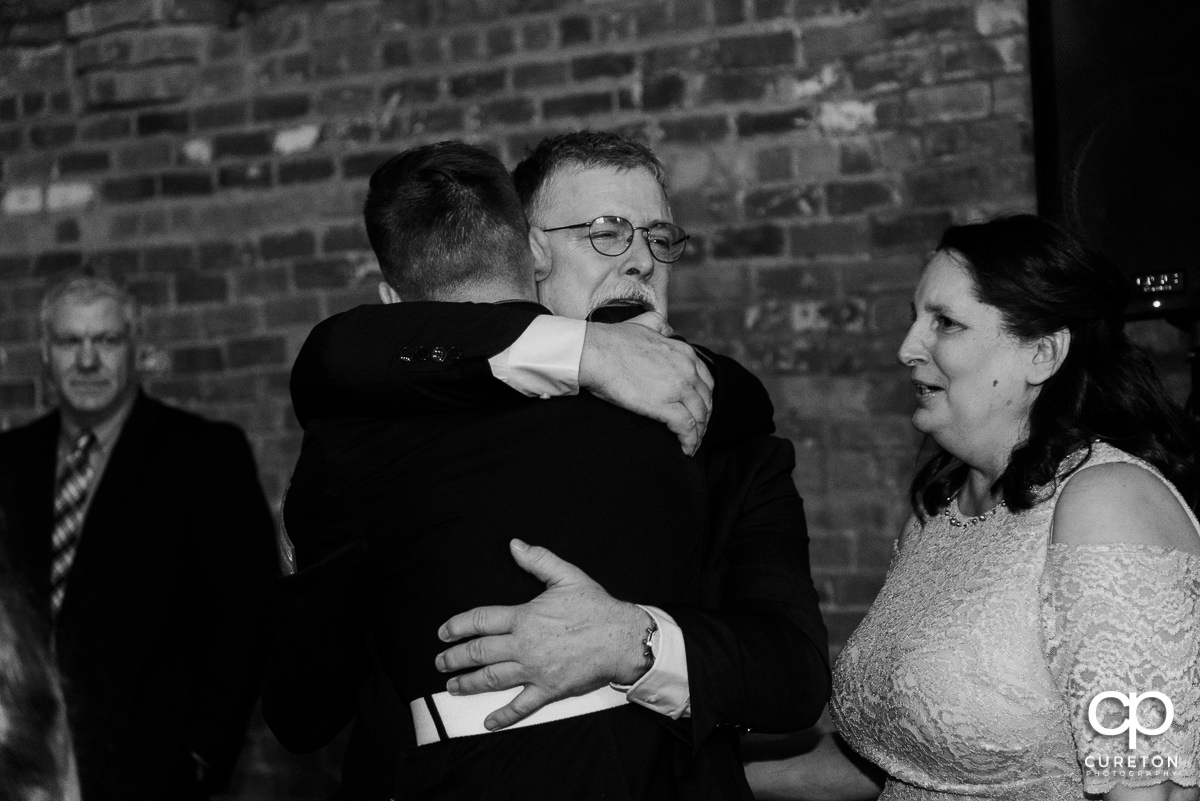 Bride's father getting emotional during a welcome speech at the reception.