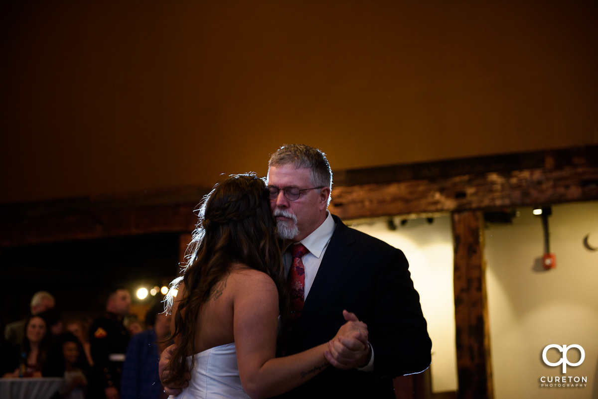 Father of the bride dancing with his daughter.