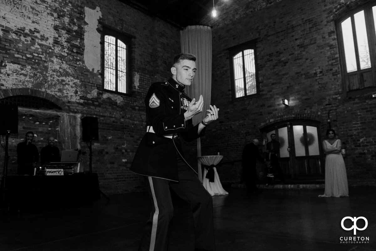 Groom asking the bride's mom to dance.