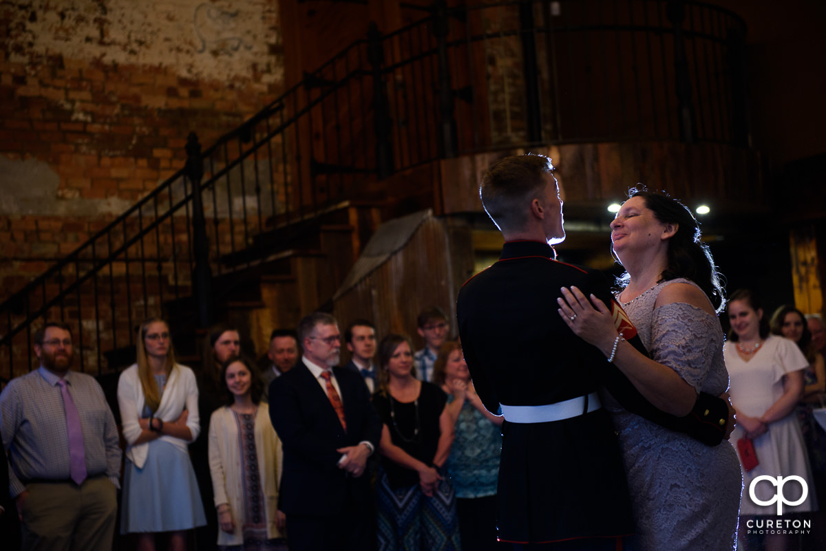 Groom dancing with the bride's mother.