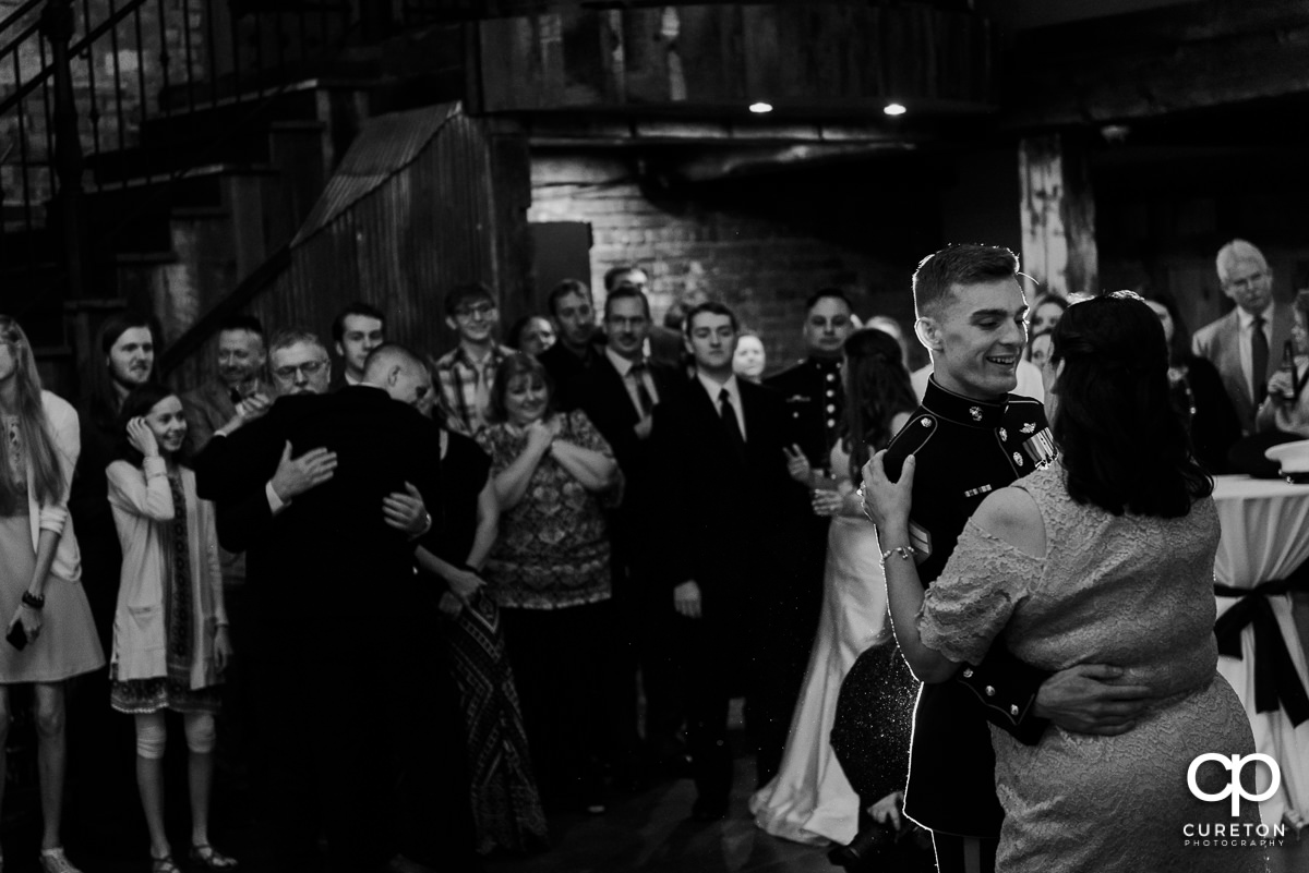 Groom dancing with the bride's mother.