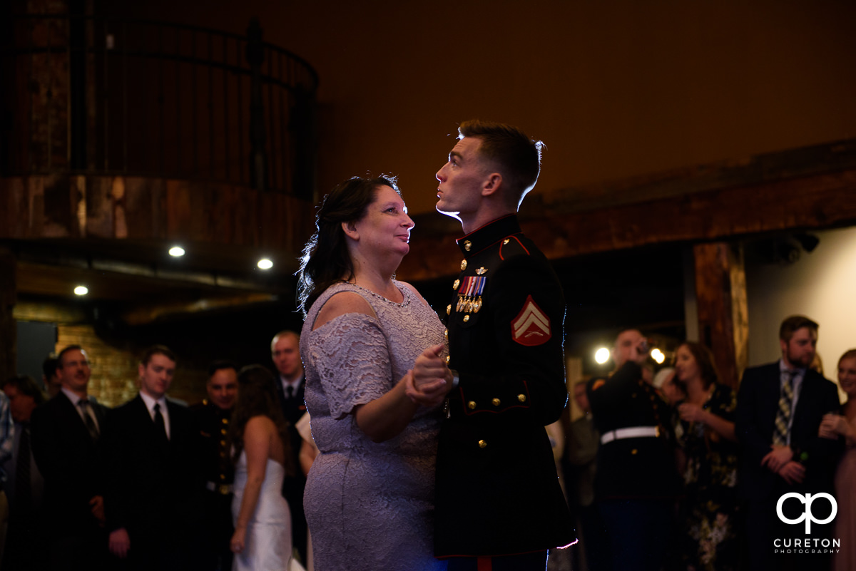 Groom dancing with the bride's mother.