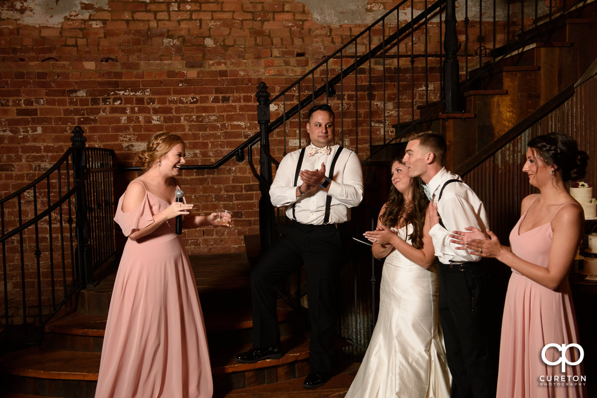 Bridesmaids giving speeches.