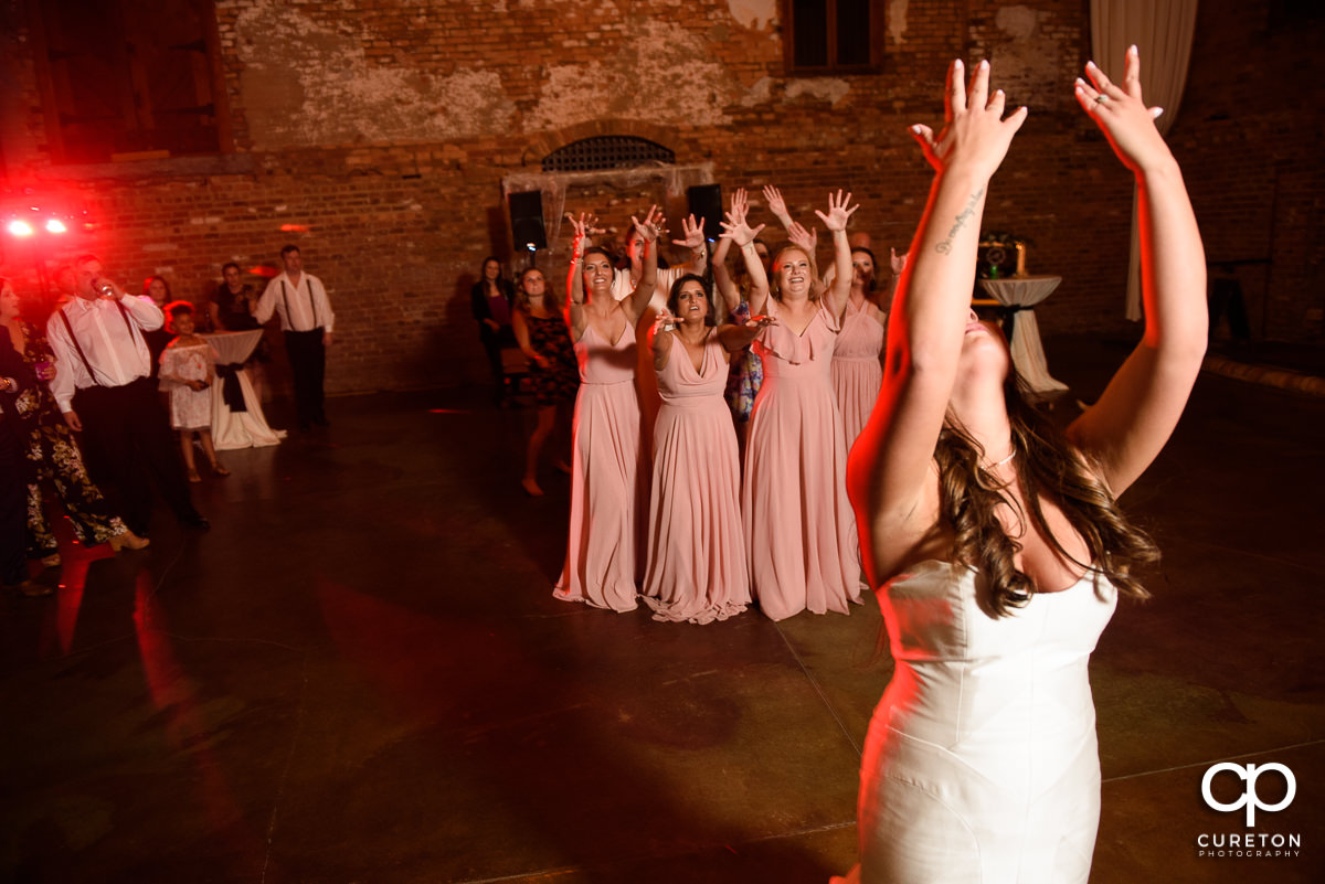 Bride tossing the bouquet.