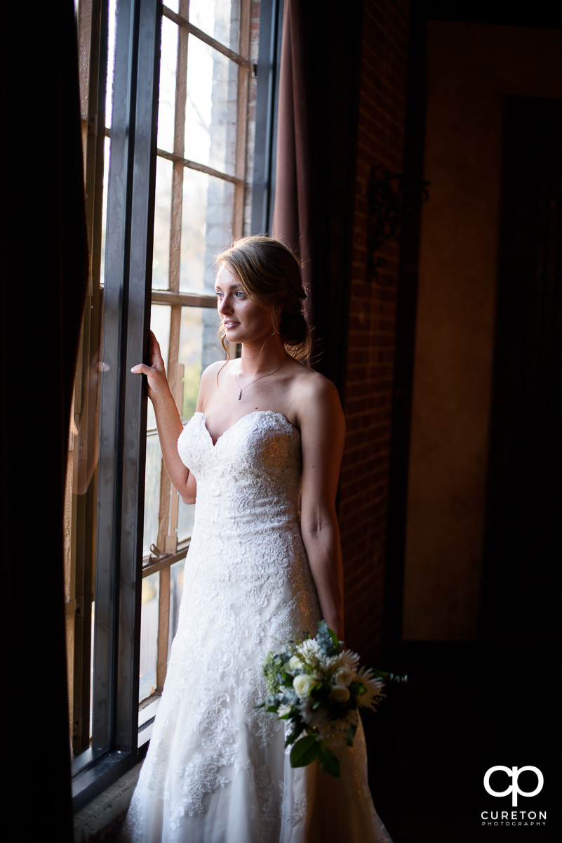 Bride in the window at Revel Event Center.