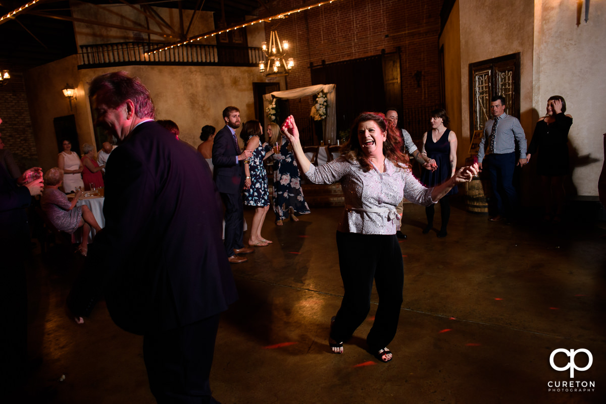 Guests dancing during the reception at Revel.