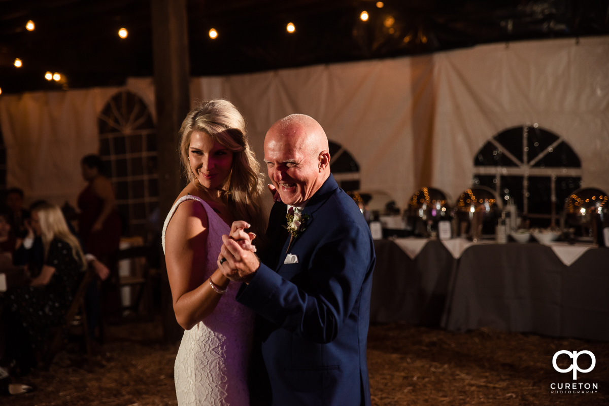 Bride and her father dancing.