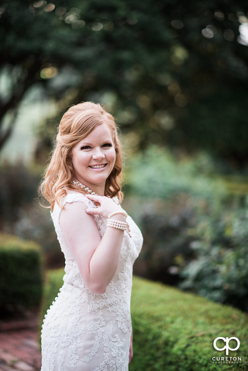 Bride at golden hour in the rose garden at Furman.