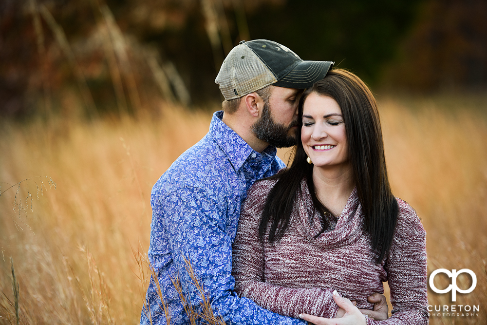 Future bride and groom cuddling during their Blue Ridge engagement session.