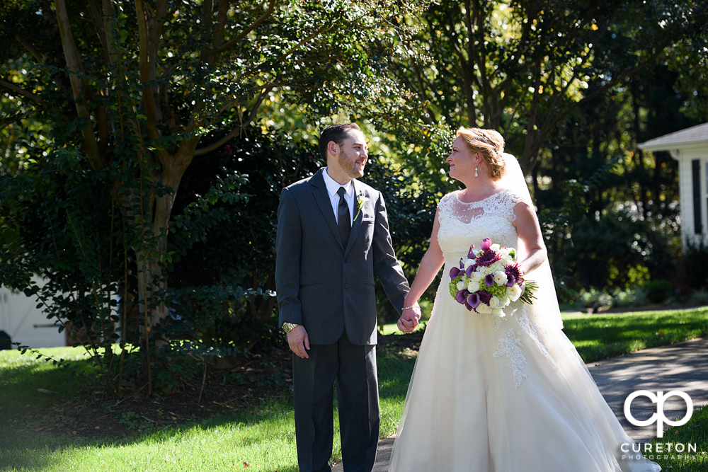 Bride and groom walking the grounds of the Ryan Nicholas Inn in Mauldin,South Carolina.