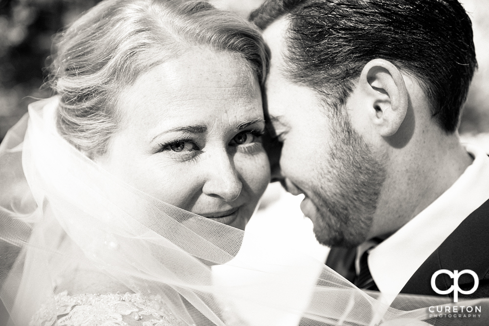 Close up black and white of bride and groom.