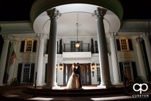 Epic shot of a bride and groom in front of the Ryan Nicholas Inn