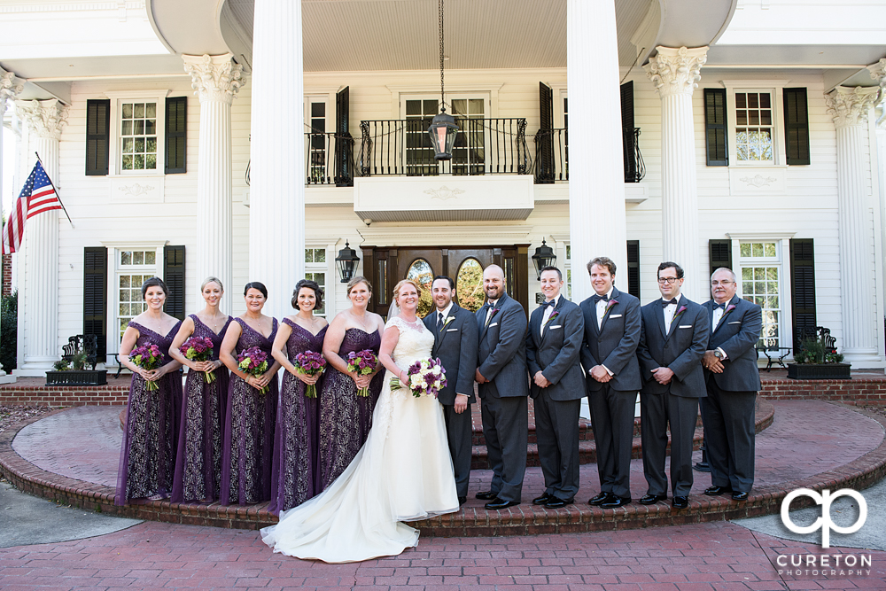 The wedding party in front of The Ryan Nicholas Inn.