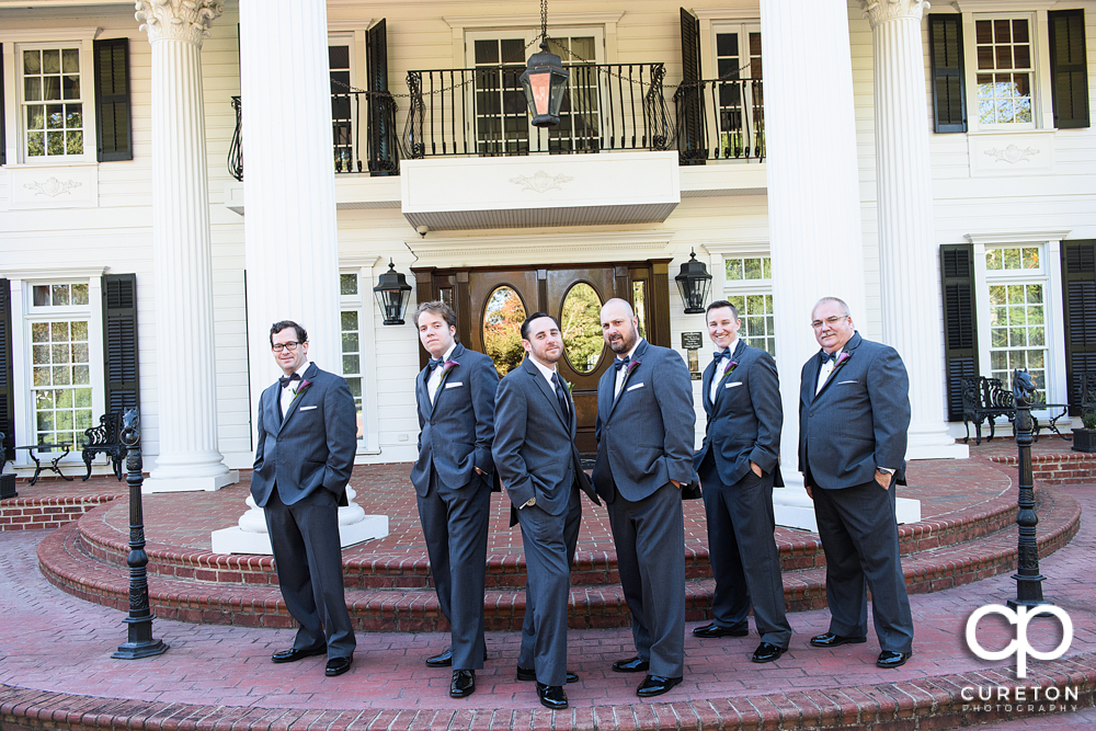 The groom and groomsmen out in front of the Ryan Nicholas Inn.