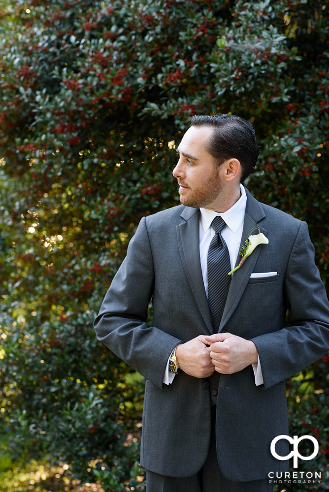 The groom standing outside.