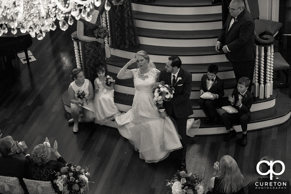 Bride and groom walking back down the aisle.